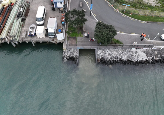 Aerial image of wastewater overflow entering the harbour via the stormwater pipe at Freemans Bay